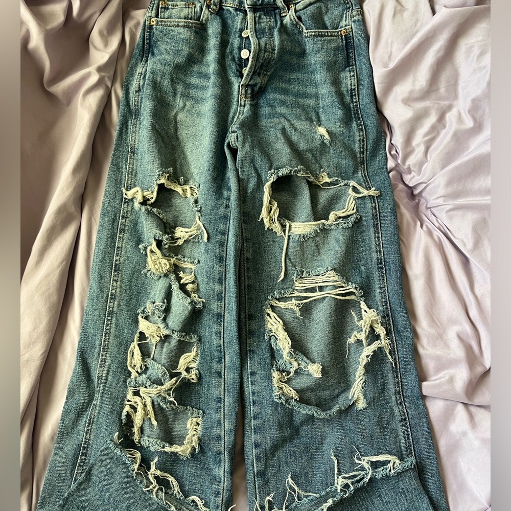 Pacsun size 25 ripped baggy jeans.